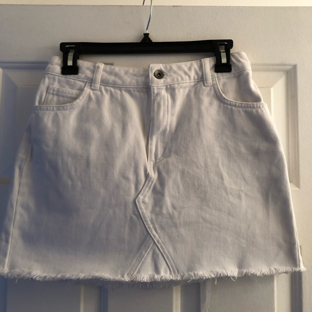 white distressed denim skirt with fray bottom